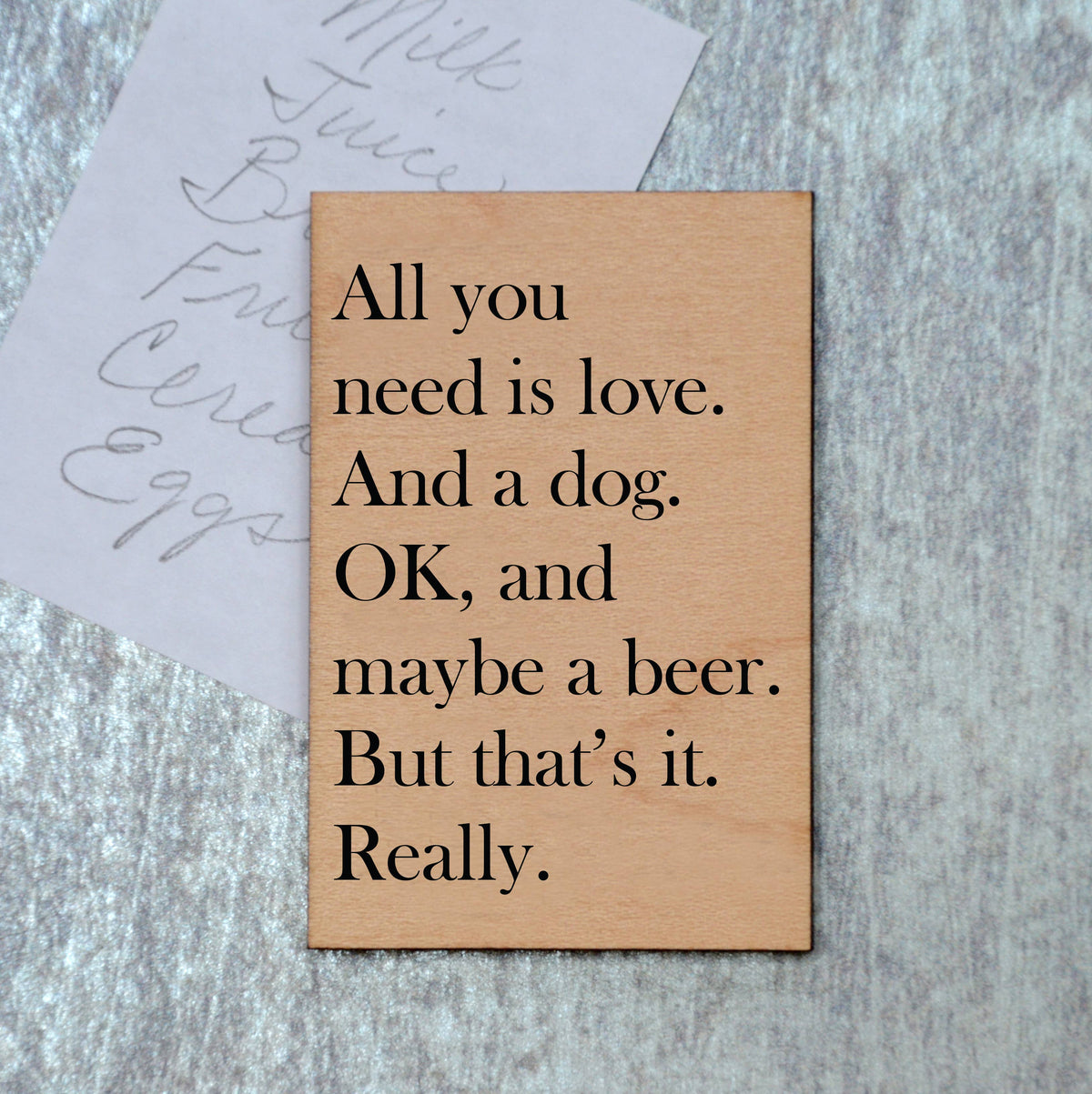 “All you need is love and a dog. OK, and maybe a beer." Funny Magnet